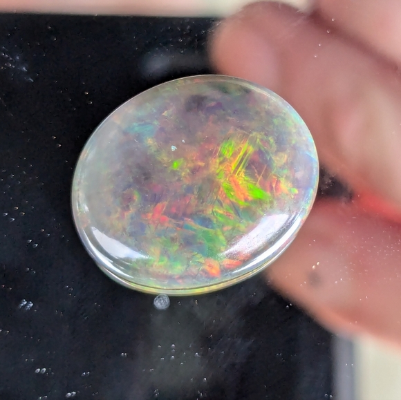 5.85ct Natural play of color black opal - Picture 6 of 16
